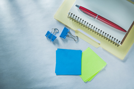 Note-book paper folder biro pen document clips sticky reminders.