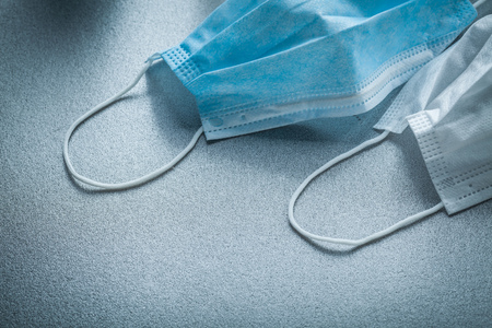 Disposable medical face masks on grey background.の写真素材