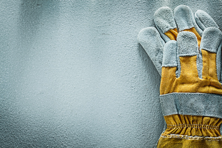 Pair of protective gloves on concrete background copy space.の写真素材