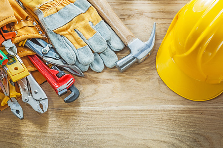 Construction tooling tool belt safety gloves building helmet.