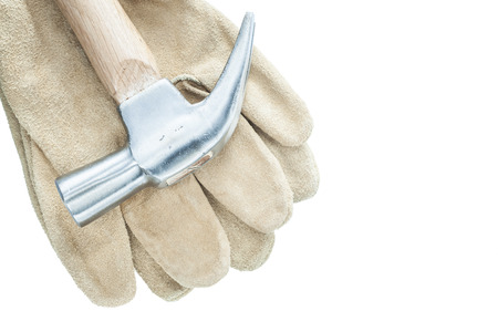 Claw hammer pair of safety gloves isolated on white.
