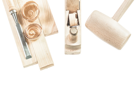 Wooden mallet bricks chisel shavings shaving plane isolated on white.の写真素材