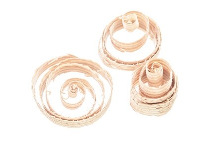 Curled wood scobs isolated on white.の写真素材
