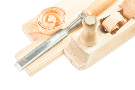 Wooden bricks chisel shavings planer isolated on white.