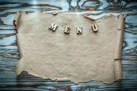 Text paper roll on vintage wooden surface.の写真素材