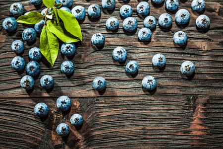 Heap of sweet blueberries on vintage wooden background.の写真素材