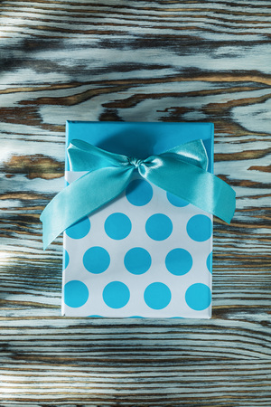 Blue gift box on vintage wooden board.の写真素材