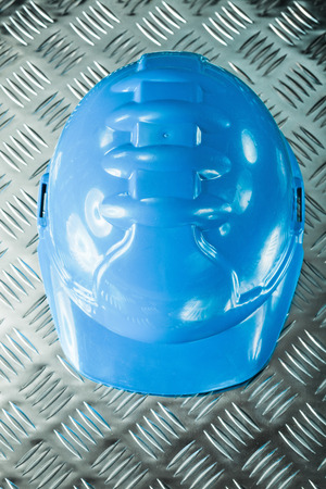Safety building helmet on grooved metal sheet.の写真素材