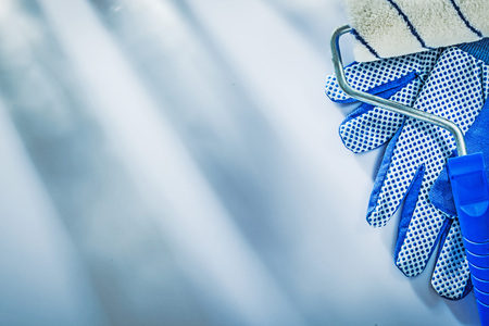 Protective gloves paint roller on white background.の写真素材