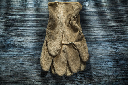 Protective gloves on wooden board.の写真素材