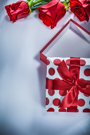 Present box bunch of roses on white background.の写真素材