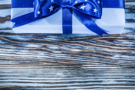 Blue wrapped present box on wooden board.の写真素材