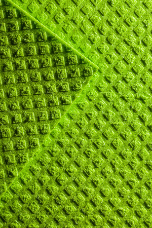 New green dishwashing cloth backdrop.の写真素材