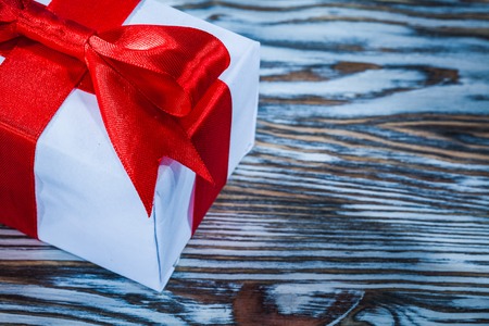 Red birthday present box on wooden background.の写真素材