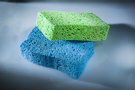 Washing sponges on white surface.