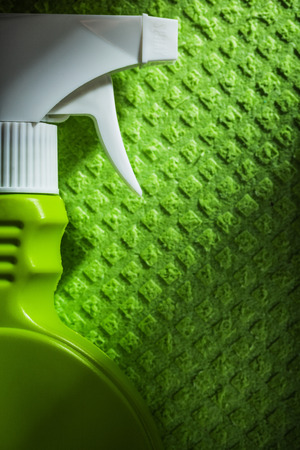Kitchen sprayer on green washcloth top view.の写真素材