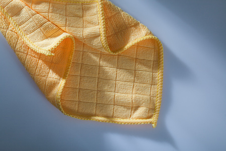 New household dishcloth on white surface.