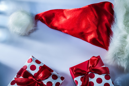 Red Santa hat wrapped present box on white background.の写真素材