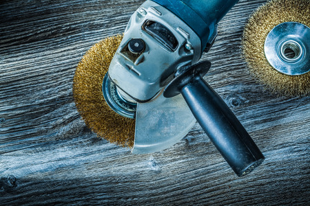 Used rotary wire brushes on vintage wooden board.の写真素材