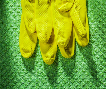 Protective gloves on cleaning dishcloth.の写真素材