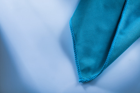 Cleaning cloth on white surface.