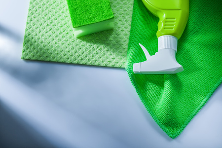 Kitchen dishwashing cloth sprayer sponge on white background.