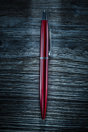 Pen on vintage wooden board.の写真素材