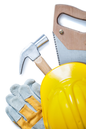 handsaw gloves hammer helmet isolated on whiteの写真素材
