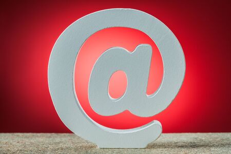 email symbol on red backgroundの写真素材