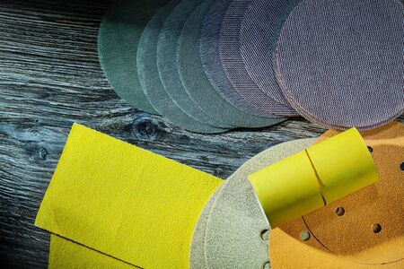 abrasive treatment tools glasspaper and sanding discs on vintage woodの写真素材