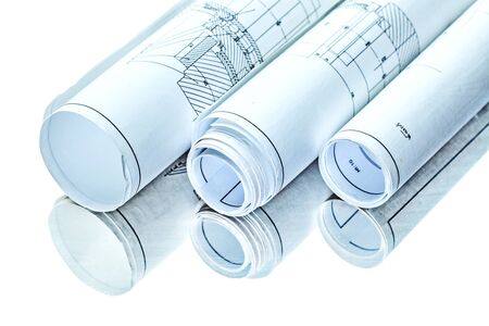 three rolled isolated blueprints on mirror