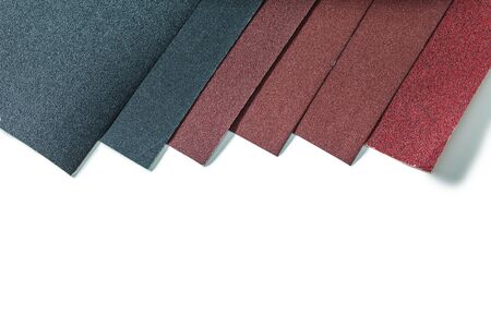 sheets of abrasive paper isolated on white background very close up