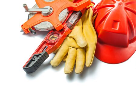 isolated construction tools red helmet gloves level big measure tapeの写真素材