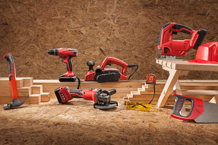 Set Of Working Tools. Electric Carpenter Hand Tools Set. On Plywood Background.の写真素材