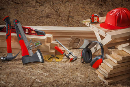 Carpentry Tools Set Of Red Color On Wooden Backgroundの写真素材