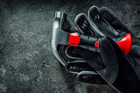 Little Claw Hammer And Black Working Glovesの写真素材