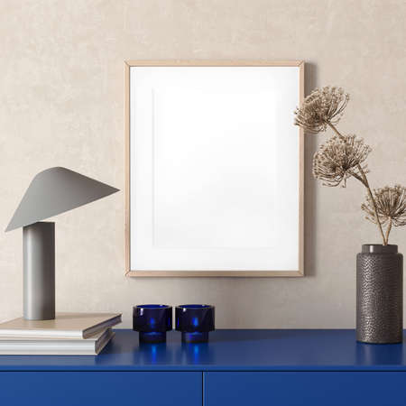 3d render of a modern mockup interior with wooden frame on an empty wall and a blue sideboard with dark grey vase with dried flowersの写真素材