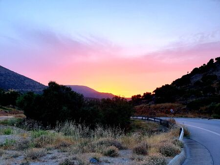Crete mountains, beautiful evening sunset, view on villageの写真素材