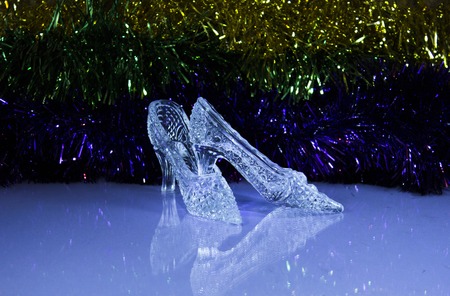 New Year shoes of Cinderella on the tinsel, as babackgroundの写真素材