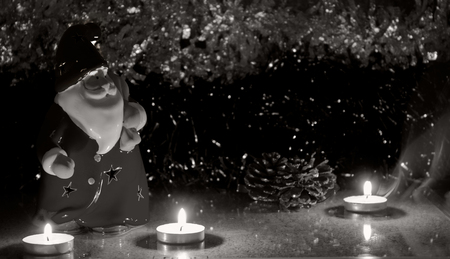 night red santa clause with candles on the tinsel, as babackgroundの写真素材