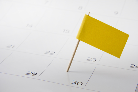 Flag on the event day on calendarの写真素材