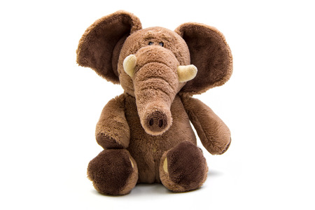 Brown elephant soft toy isolated on whiteの写真素材