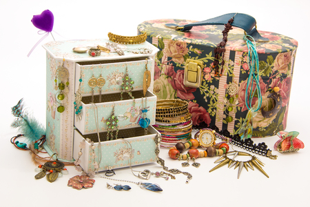 Girl's and wife's jewelry box with drawers - feminine necklace, earrings, bendants, bracelets, rings, kitsch, watch - isolated on whiteの写真素材