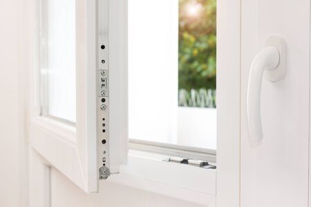 Secure anti-theft burglars-proof window locking mechanism â strong modern white PVC metal windowの写真素材