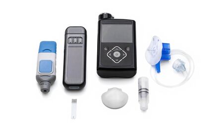 Modern Medical Accessories To Control Diabetes - insulin pump for automatic continuous injecting, reservoir and infusion set, blood sugar meter for sensor calibration, glucose sensor for monitoringの写真素材