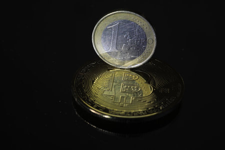 golden coin of bitcoin on a black background. close-upの写真素材