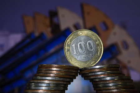 Coins stacked in the shape of the number 100 on the background of the city