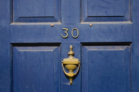 Traditional british residential front door with knocker