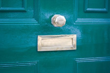 Closeup of a blue door of a traditional UK houseの写真素材