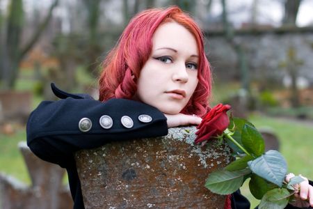 Closeup of redhead girl with a roseの写真素材